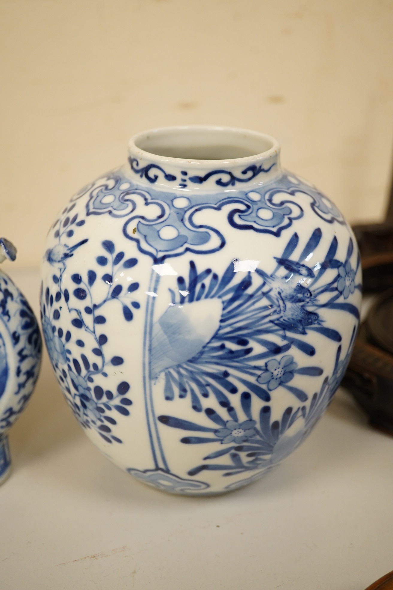 Four 19th century Chinese blue and white jars / vases, including a moon flask and double gourd vase, largest 23cm high. Condition - poor